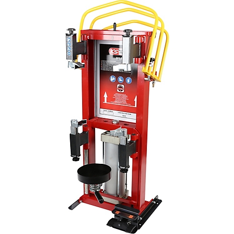 Rote Reifenmontiermaschine mit gelben Bügeln und schwarzem Sitz. Oben das Logo KST. Pfeile weisen auf die Maschine.